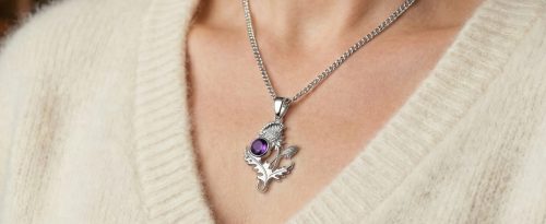 6140 silver thistle necklace on v neck sweater